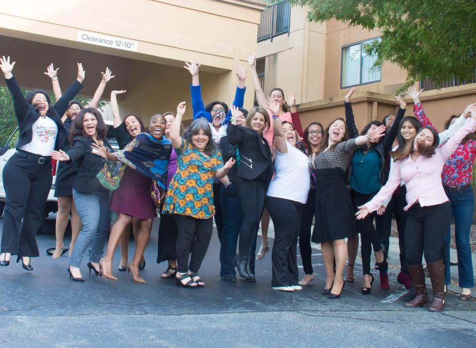 A group of women celebrating together at the Latinas Finas event.