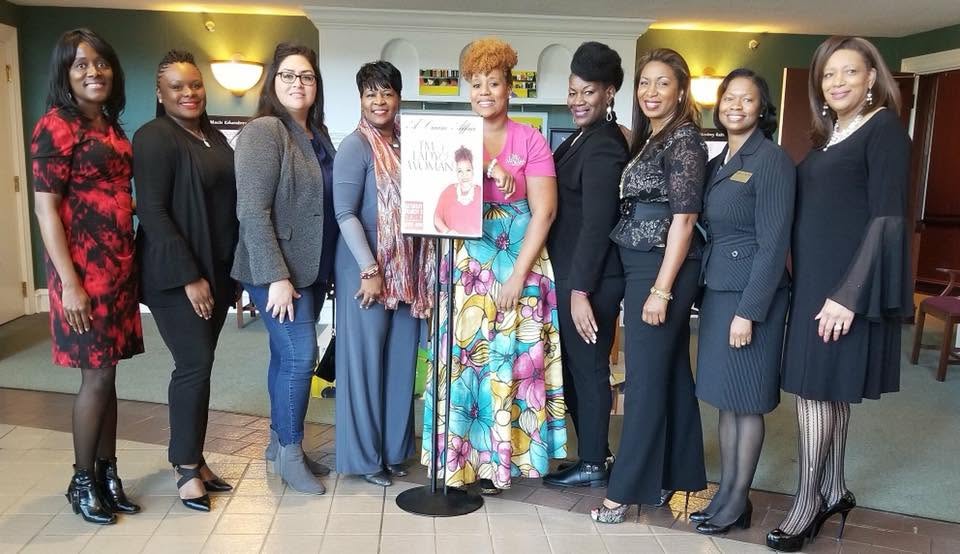 Yaya with a group of women at A Woman Affair speaking event.