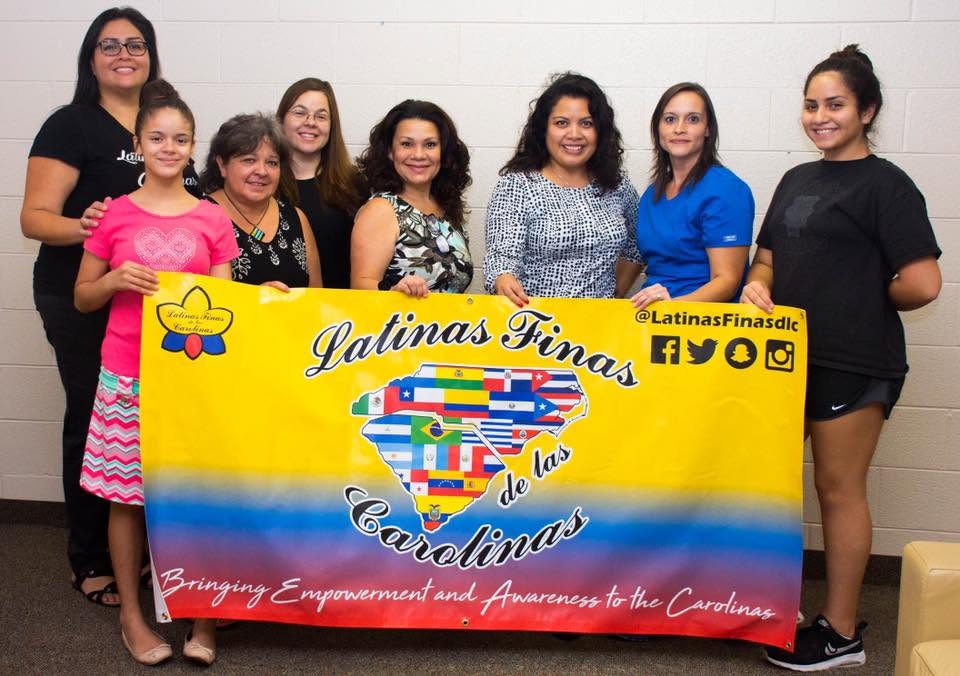 Yaya with a group at a Latinas Finas de las Carolinas community event.