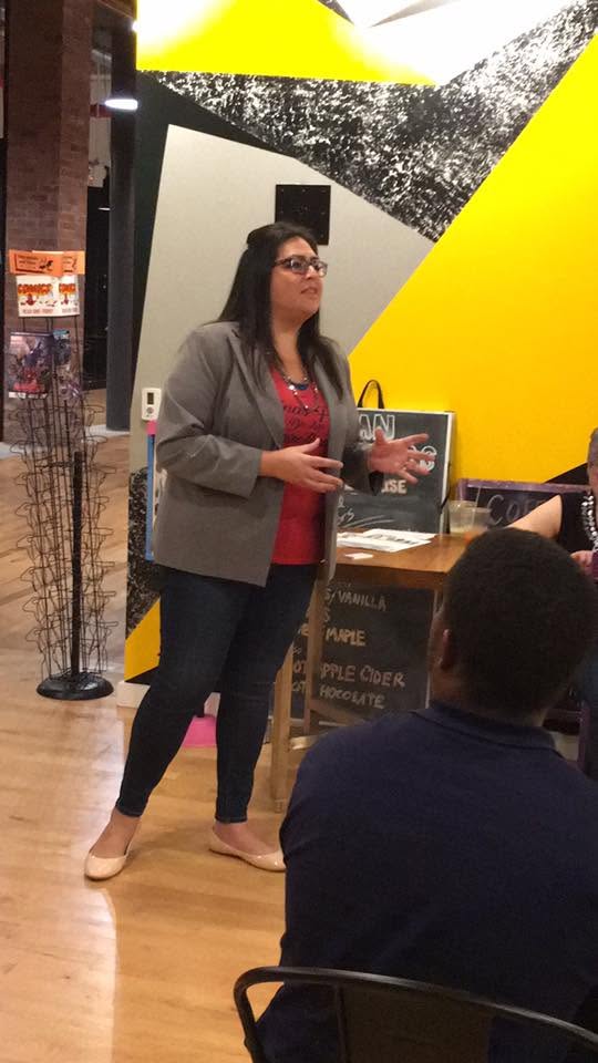 Yamile "Yaya" McBride mid-gesture while speaking to a group in Greensboro.