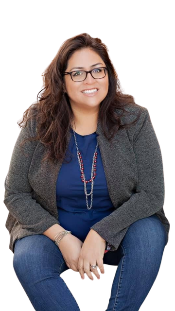 Yamile "Yaya" McBride, seated and smiling.